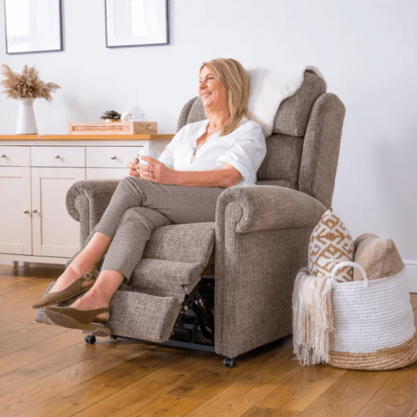 Woman seated in a riser recliner chair