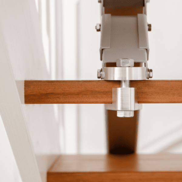 Stairlift attachment to a stair