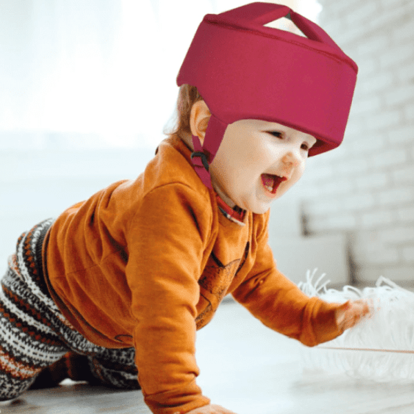 A child is wearing a protective helmet