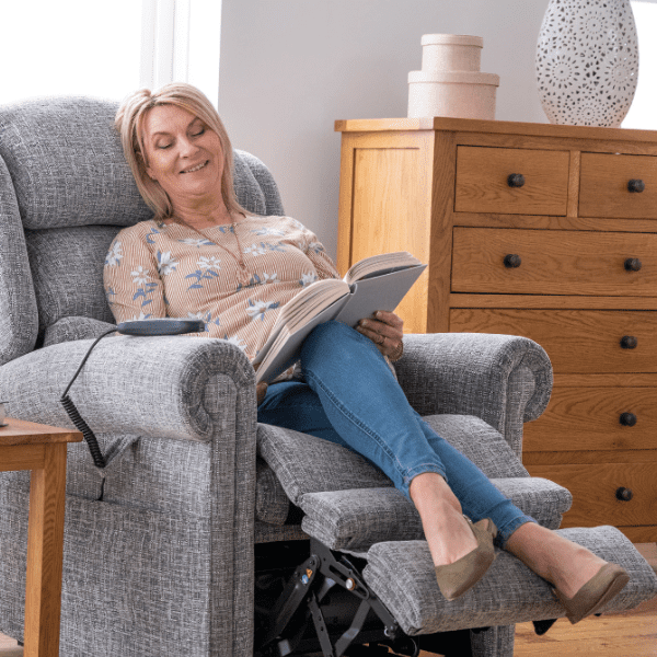 Woman is sitting on a riser recliner chair
