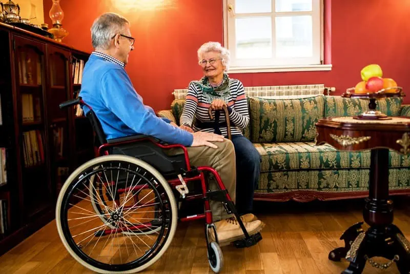 man on wheel chair and woman adapt a home